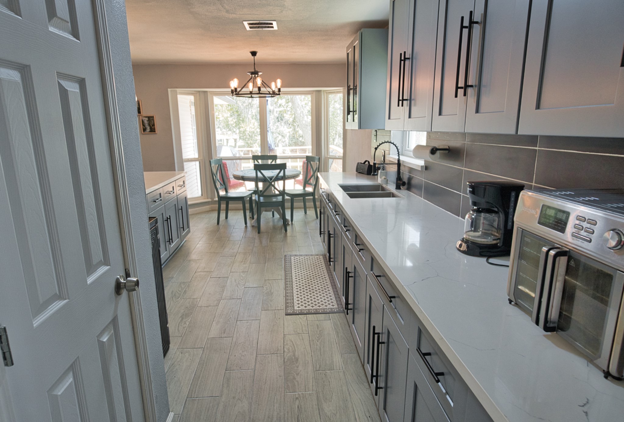 5401 County Road 334, Unit 10 Sweeny, TX 77480 - Photo 8 of 15 a kitchen with sink cabinets and appliances