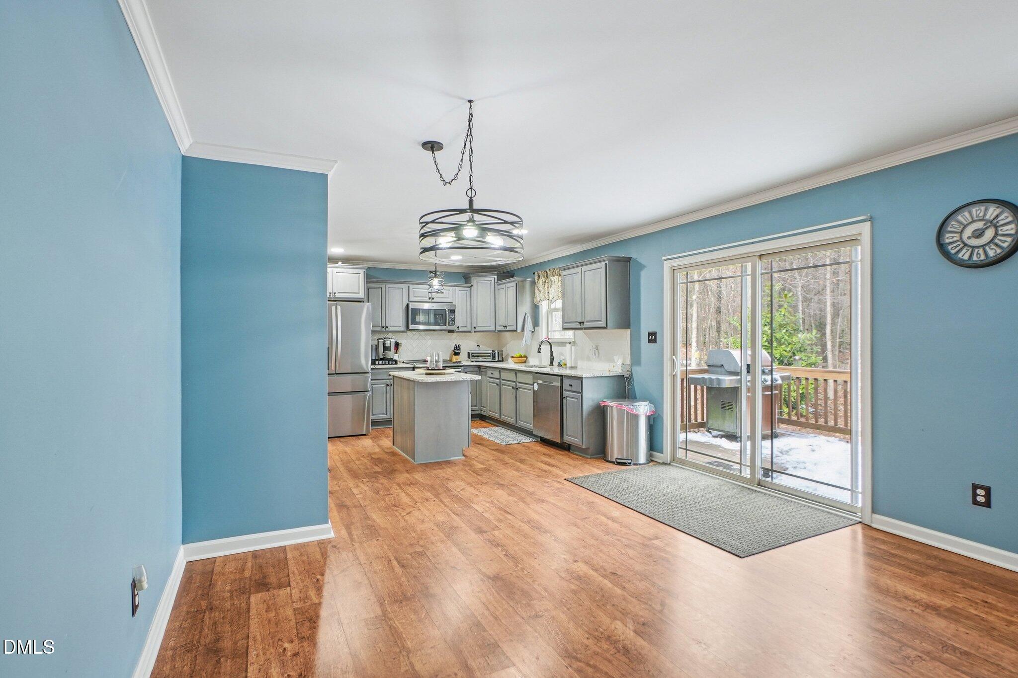 265 North Ridge Drive Louisburg, NC 27549 - Photo 11 of 33 a view of a kitchen with granite countertop cabinets a counter top space and appliances