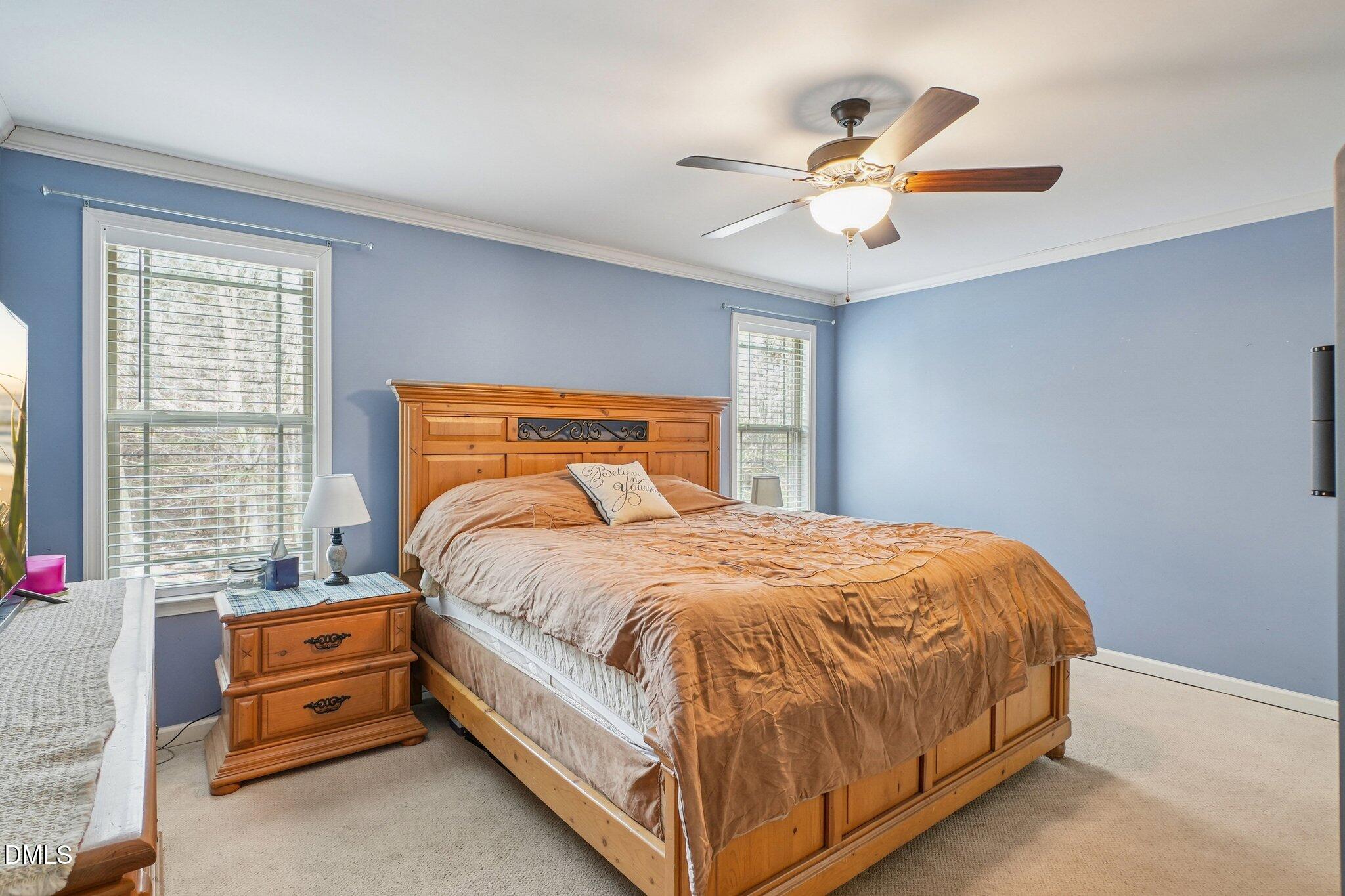 265 North Ridge Drive Louisburg, NC 27549 - Photo 19 of 33 a bedroom with a bed and window
