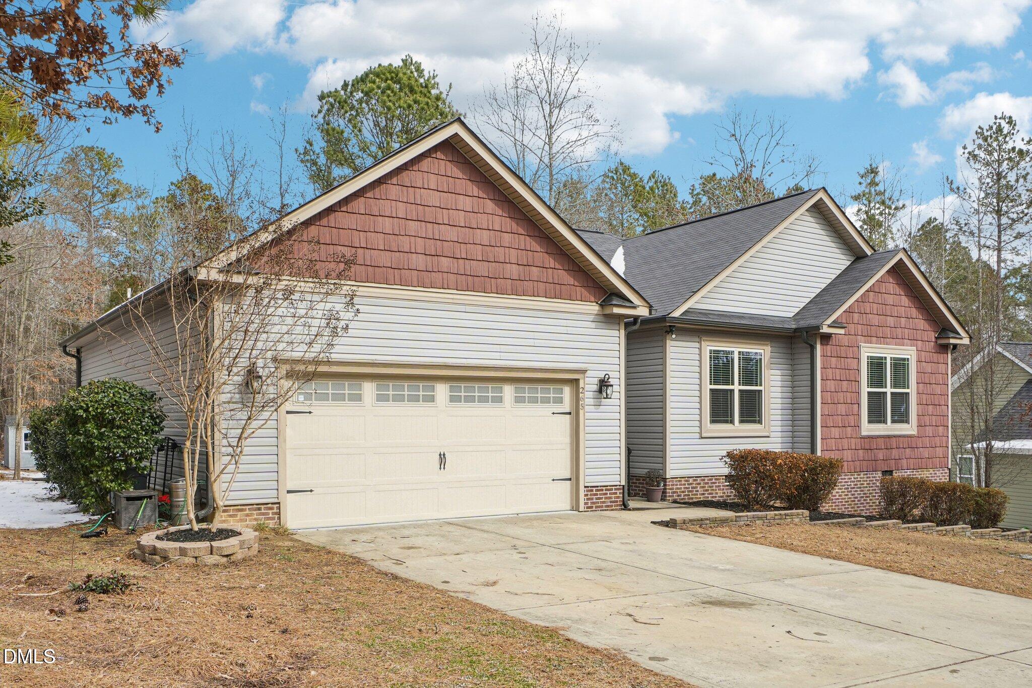 265 North Ridge Drive Louisburg, NC 27549 - Photo 2 of 33 a view of a house with a yard