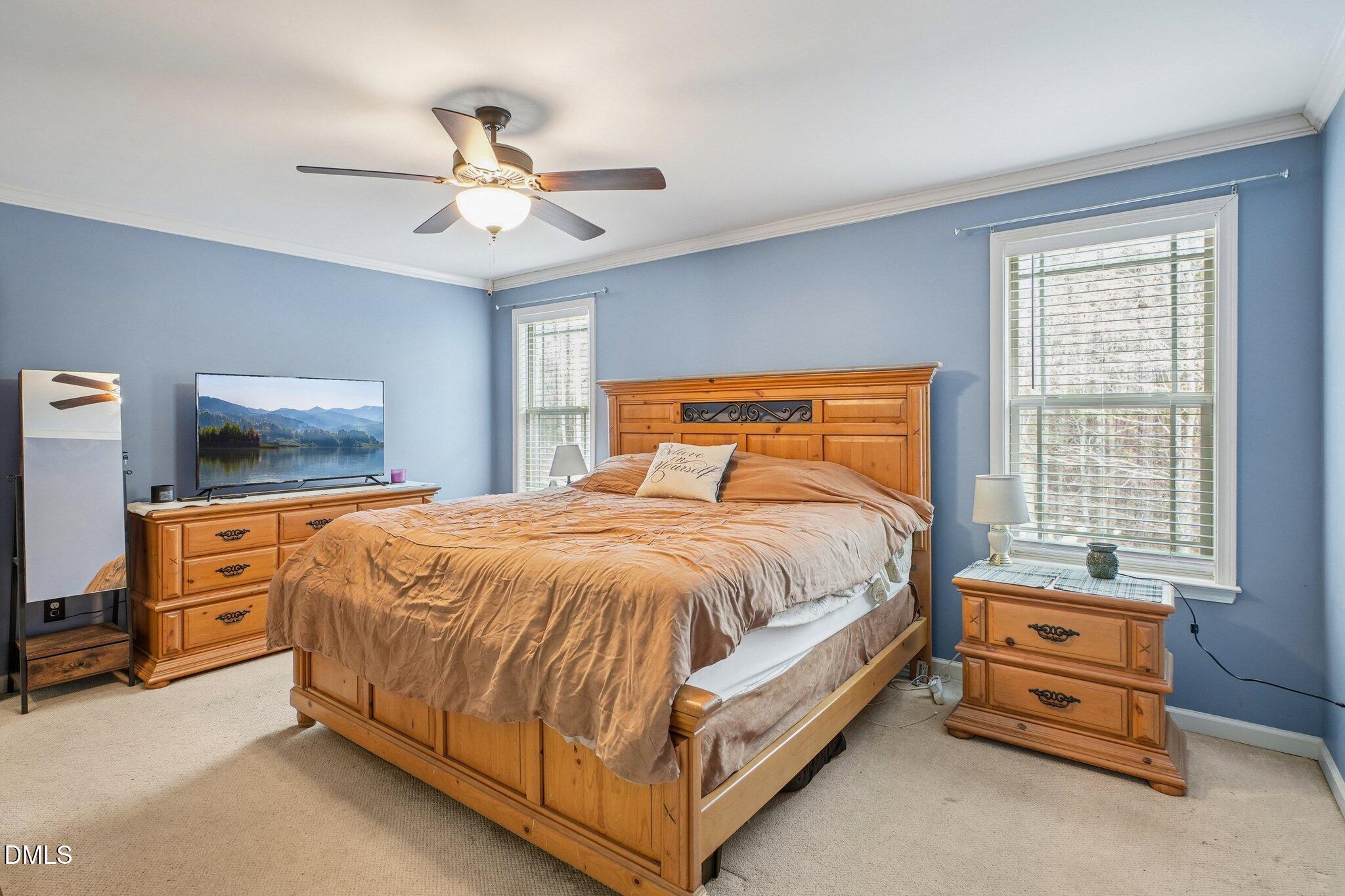 265 North Ridge Drive Louisburg, NC 27549 - Photo 21 of 33 a bedroom with a bed and window