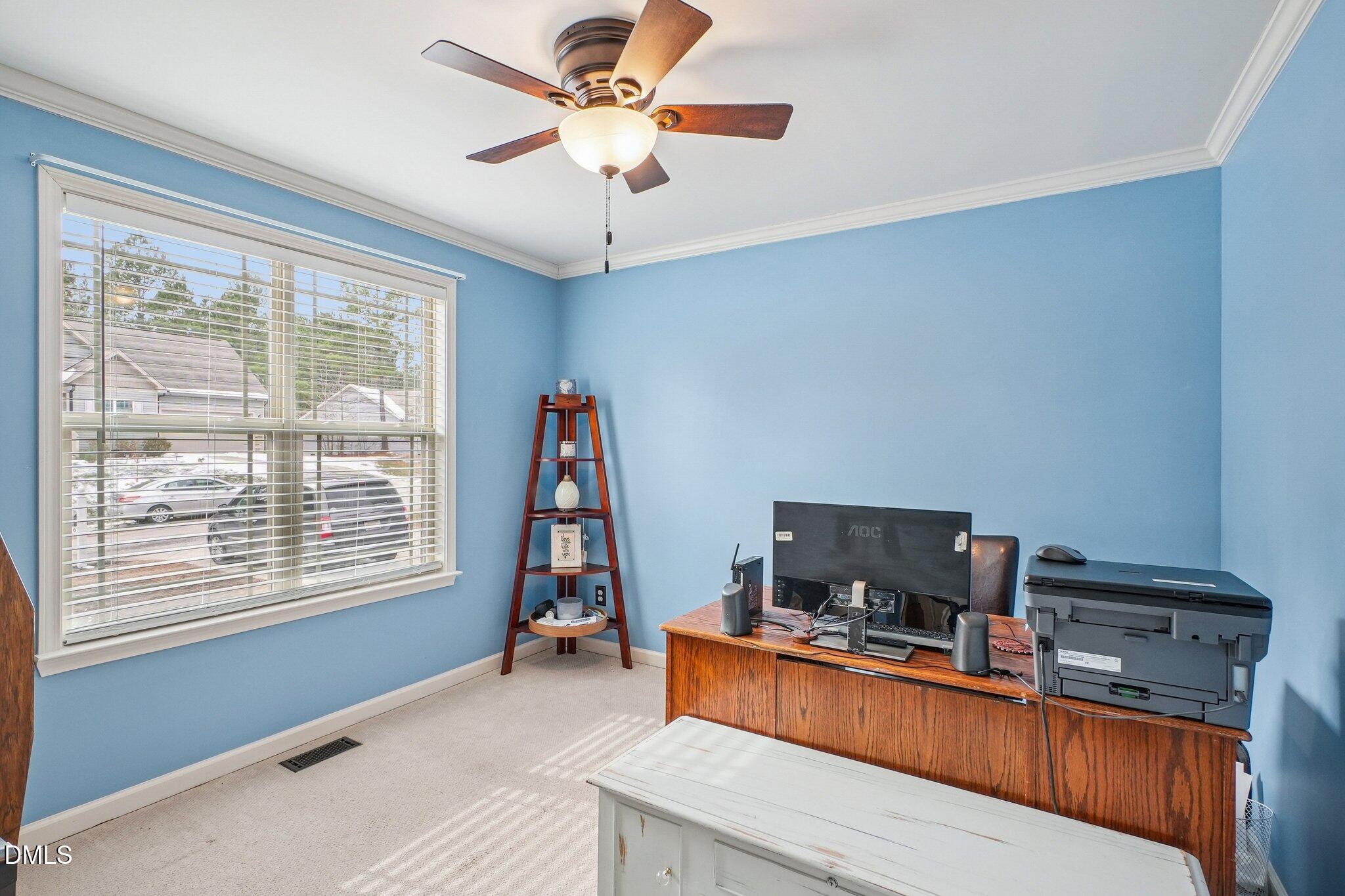 265 North Ridge Drive Louisburg, NC 27549 - Photo 25 of 33 a room with furniture and a flat screen tv