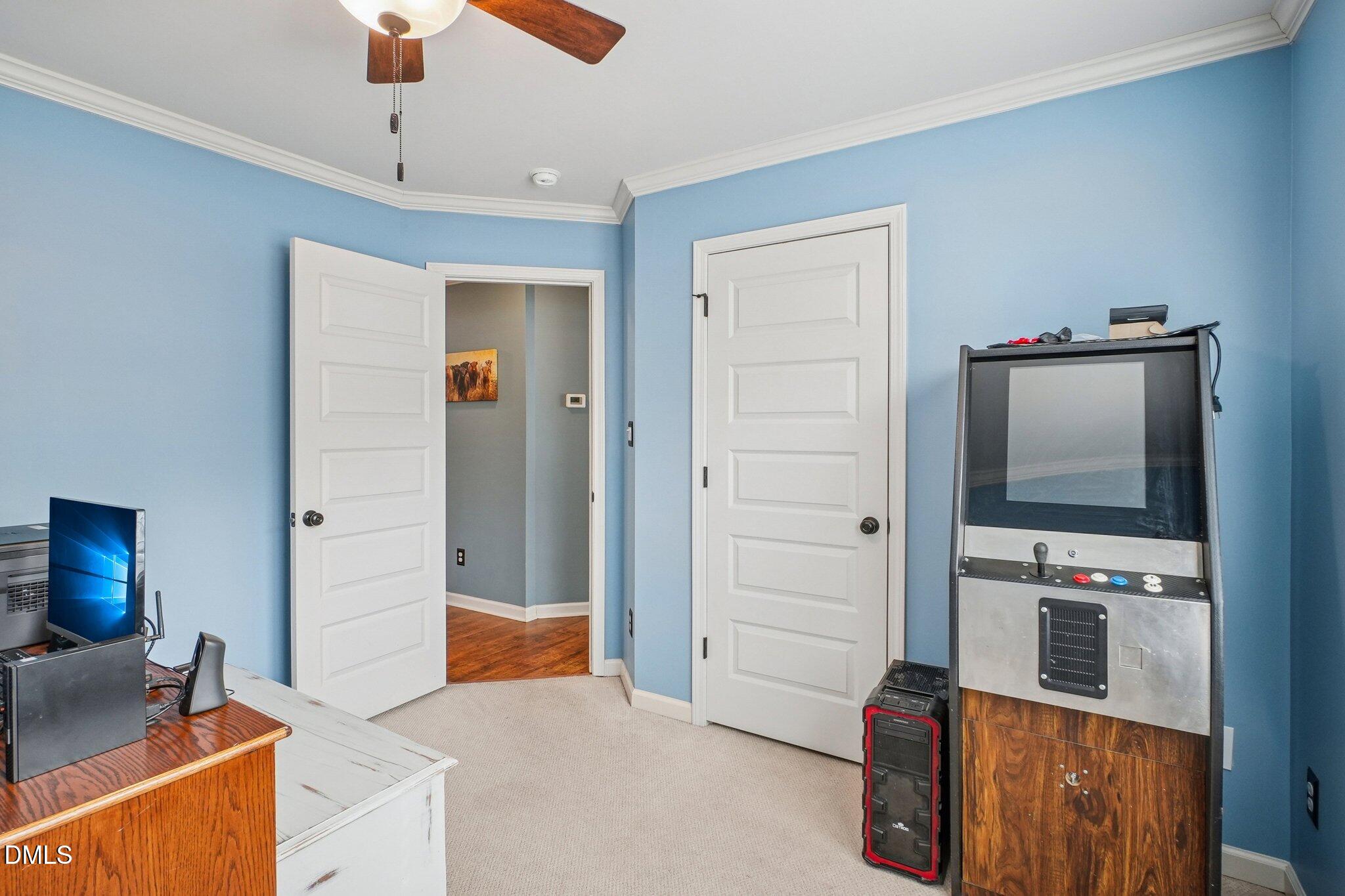 265 North Ridge Drive Louisburg, NC 27549 - Photo 26 of 33 a living room with furniture and a flat screen tv