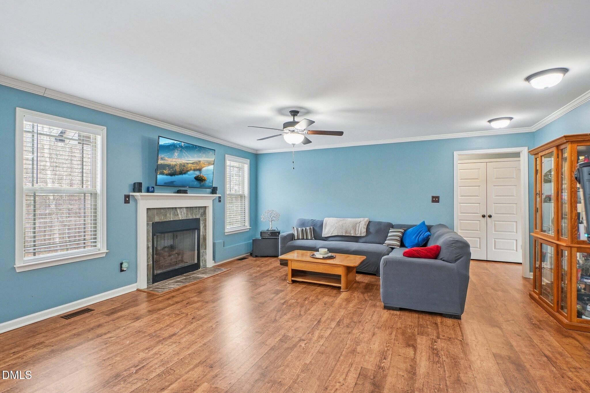 265 North Ridge Drive Louisburg, NC 27549 - Photo 8 of 33 a living room with furniture and a fireplace