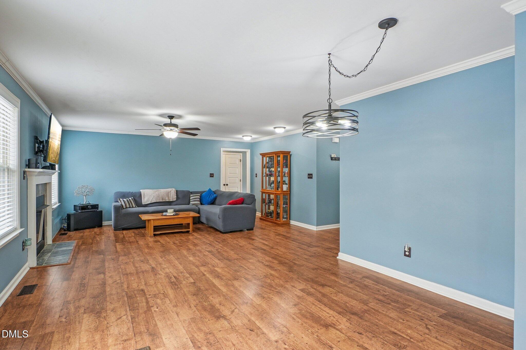 265 North Ridge Drive Louisburg, NC 27549 - Photo 9 of 33 a view of a livingroom with furniture nad wooden floor