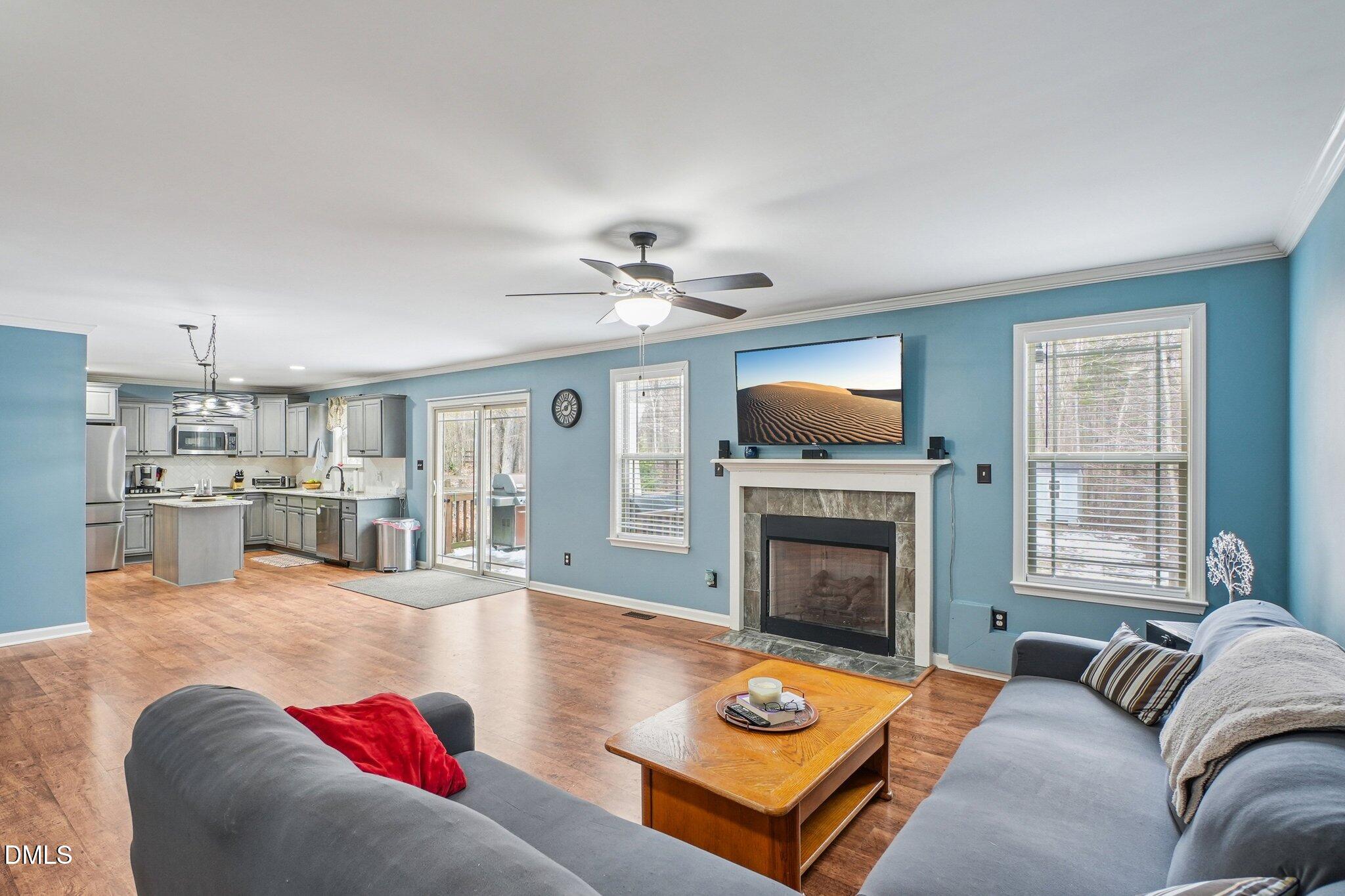 265 North Ridge Drive Louisburg, NC 27549 - Photo 10 of 33 a living room with furniture fireplace and flat screen tv