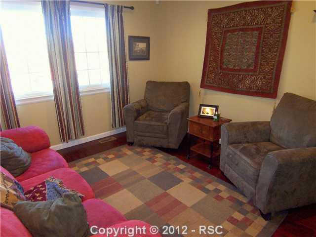 7212 River Bend Road Colorado Springs, CO 80911 - Photo 3 of 22 Beautiful Dark Wood Floors & Lots of Light