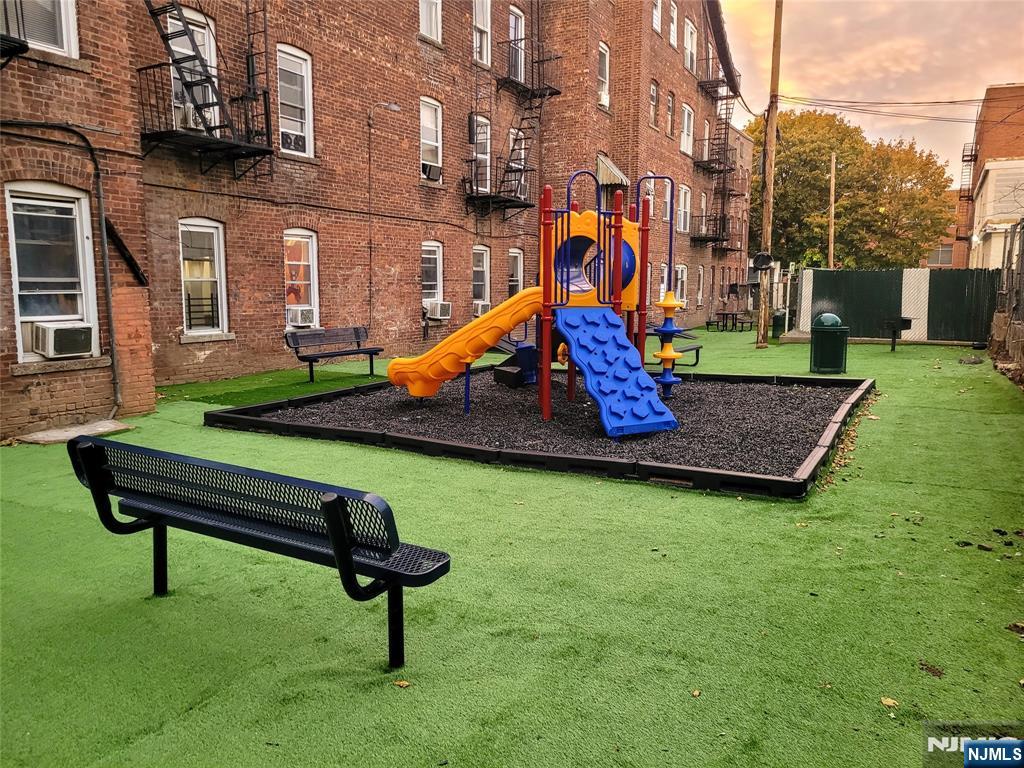 53 Henry Street, Unit D2 Passaic, NJ 07055 - Photo 11 of 12 a view of a park with iron fence