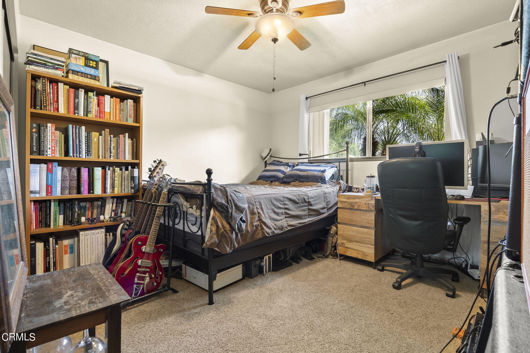1162 Tico Road Ojai, CA 93023 - Photo 18 of 53 a living room with furniture a bookshelf and a window