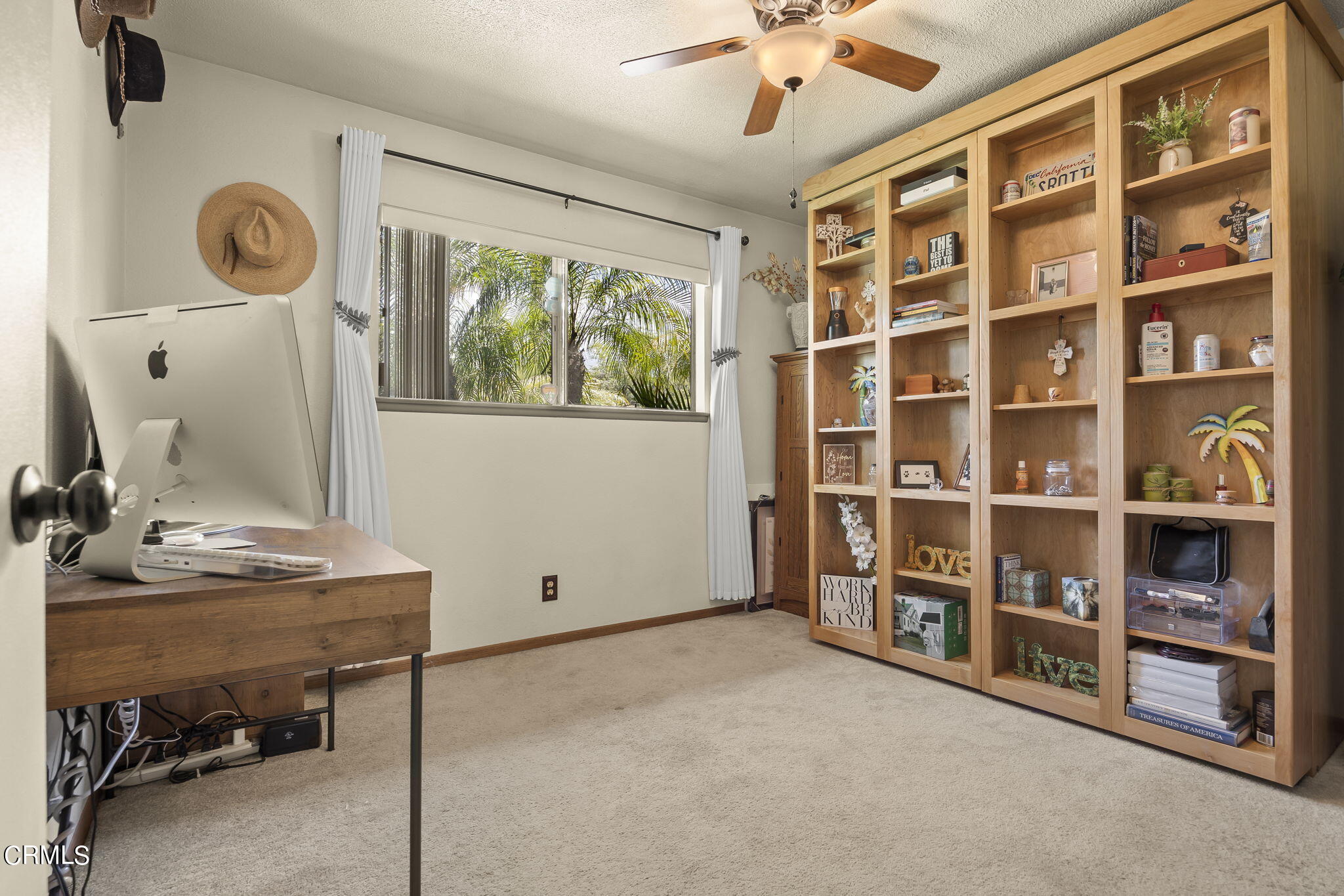 1162 Tico Road Ojai, CA 93023 - Photo 20 of 53 a view of an empty room with a bookshelf