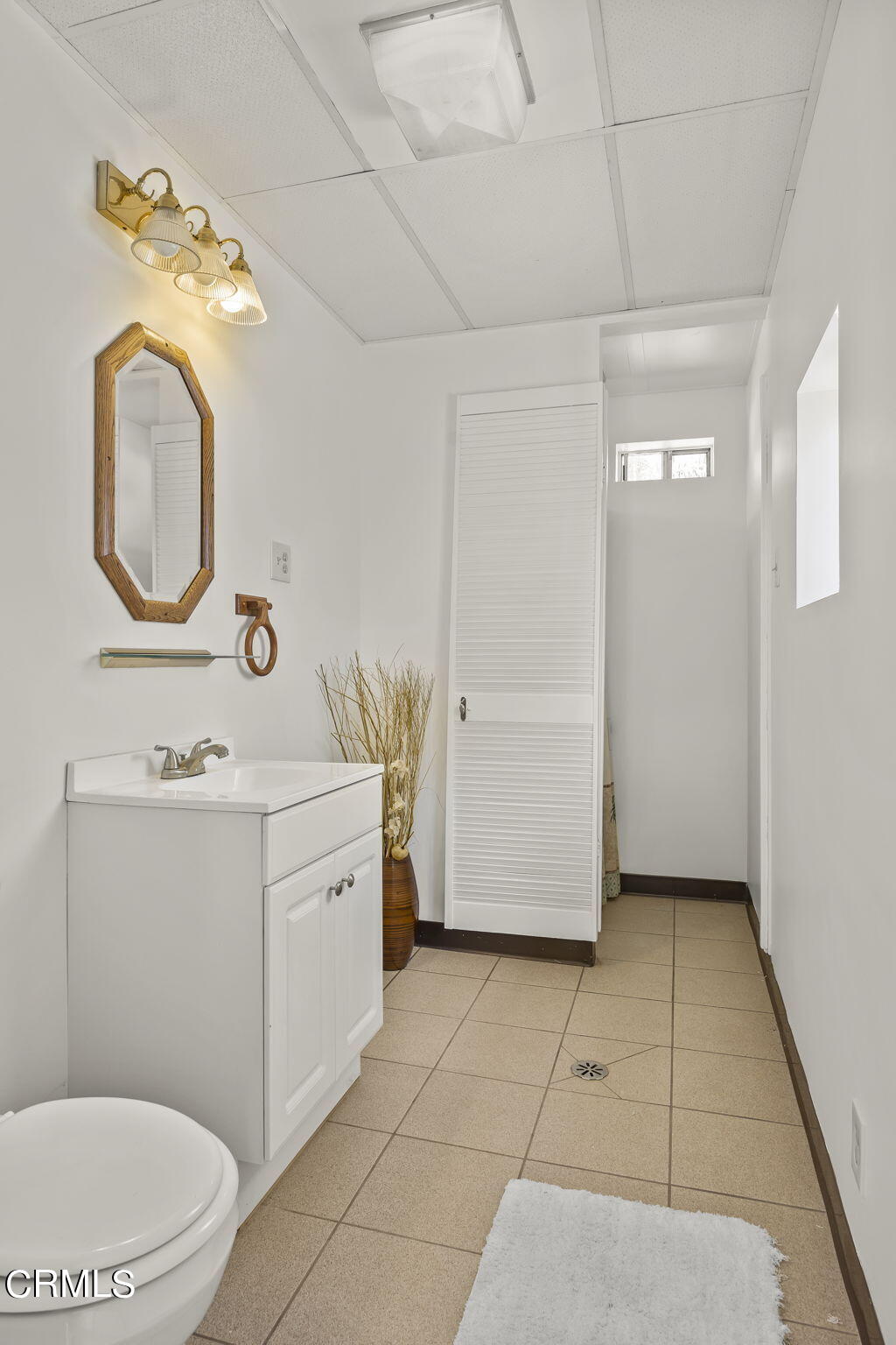 1162 Tico Road Ojai, CA 93023 - Photo 38 of 53 a bathroom with a toilet sink and mirror