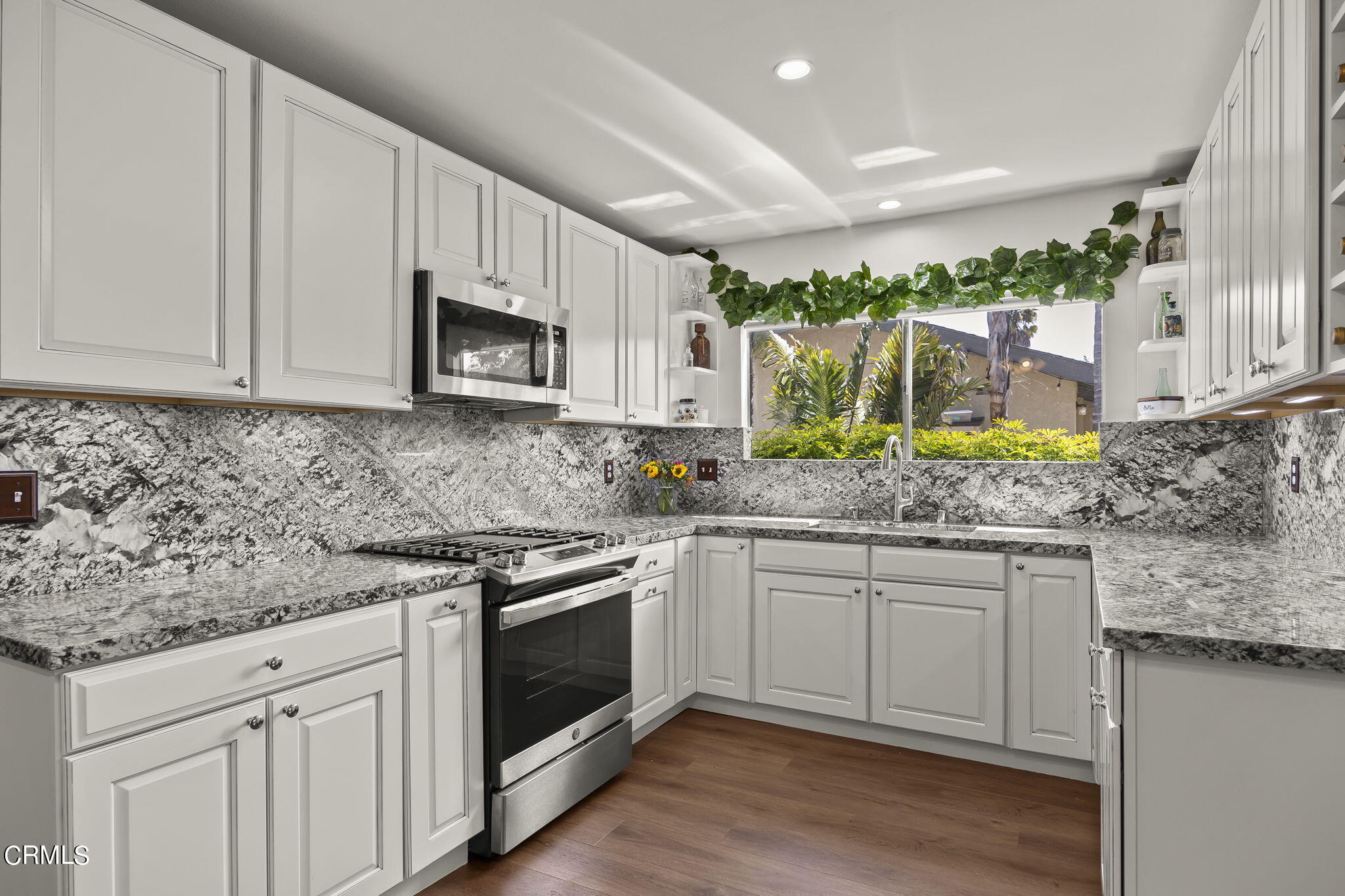 1162 Tico Road Ojai, CA 93023 - Photo 10 of 53 a kitchen with stainless steel appliances granite countertop a stove a sink and a microwave