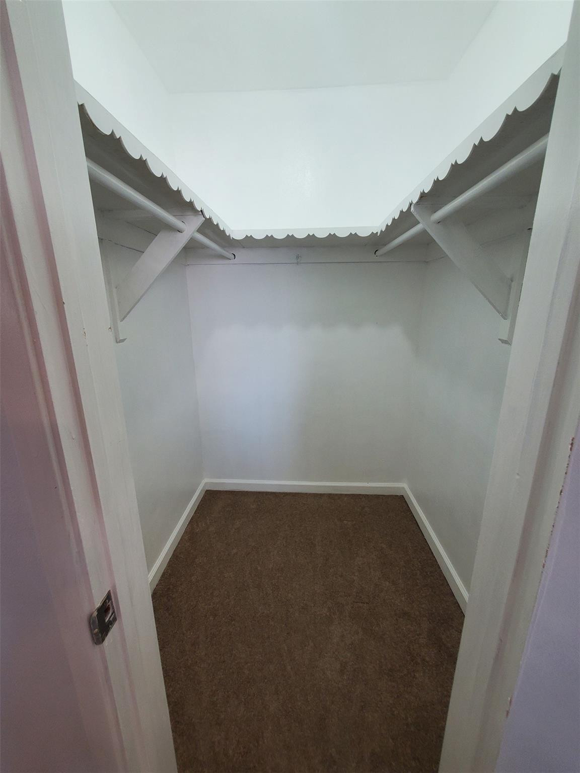 651 Pine Drive, Unit 305 Pompano Beach, FL 33060 - Photo 14 of 15 a view of a room with racks on the wall