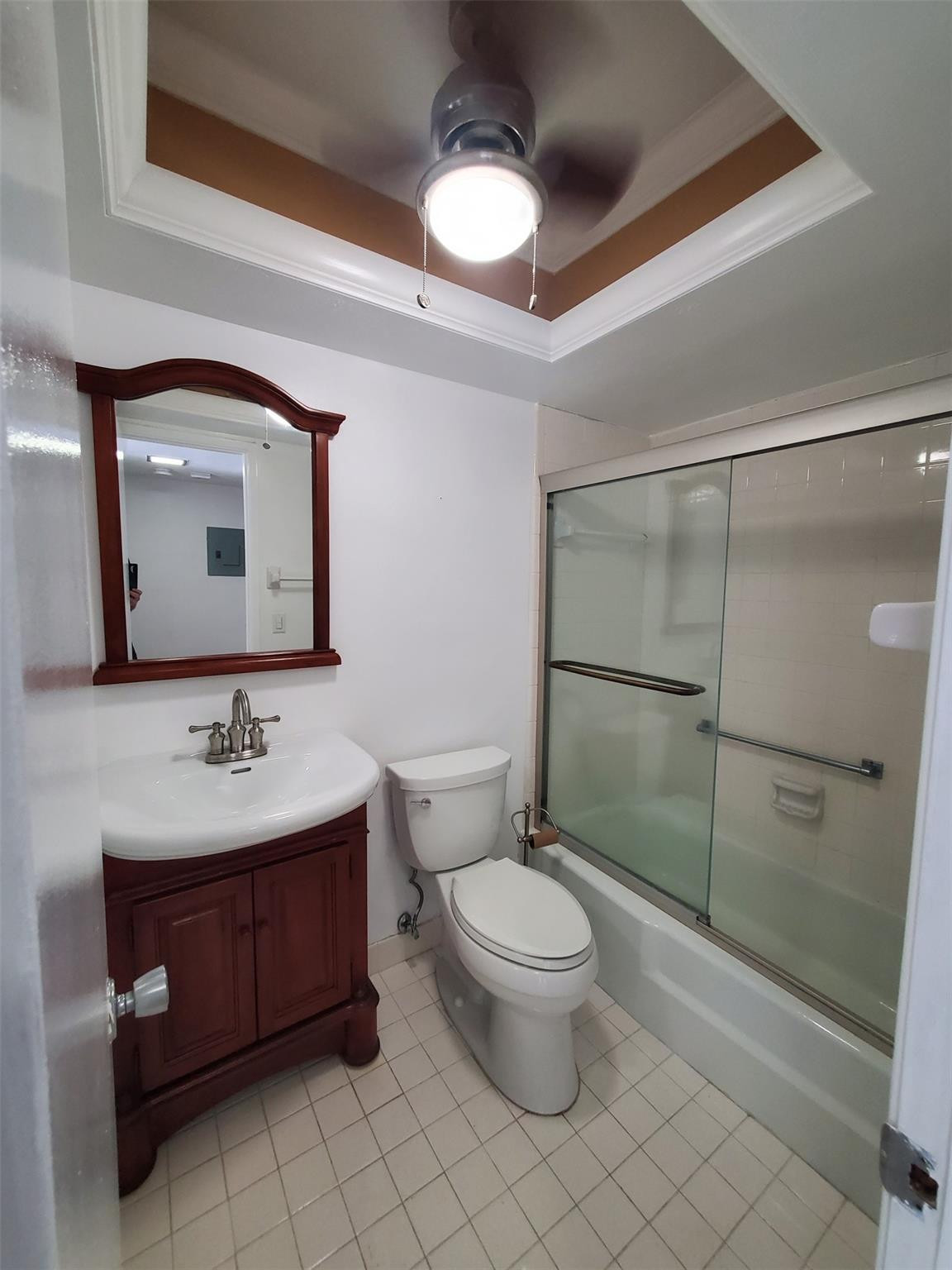 651 Pine Drive, Unit 305 Pompano Beach, FL 33060 - Photo 9 of 15 a bathroom with a toilet sink and mirror
