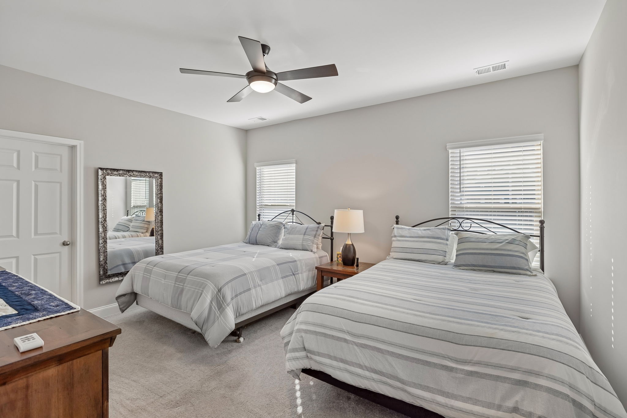 1017 Violet Street Spring Hill, TN 37174 - Photo 14 of 36 a bedroom with two beds and a chandelier