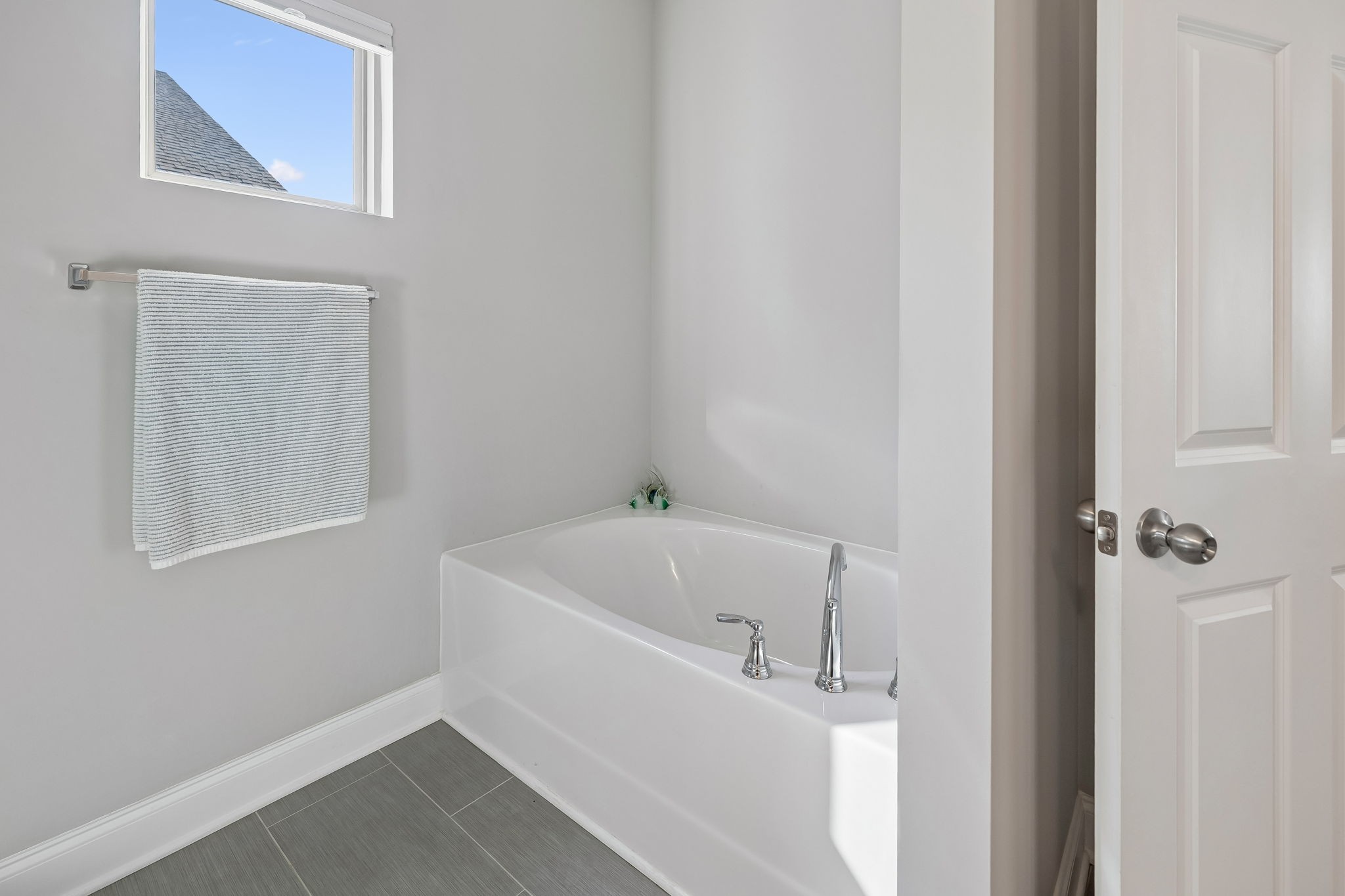 1017 Violet Street Spring Hill, TN 37174 - Photo 17 of 36 a white bath tub sitting next to a white sink