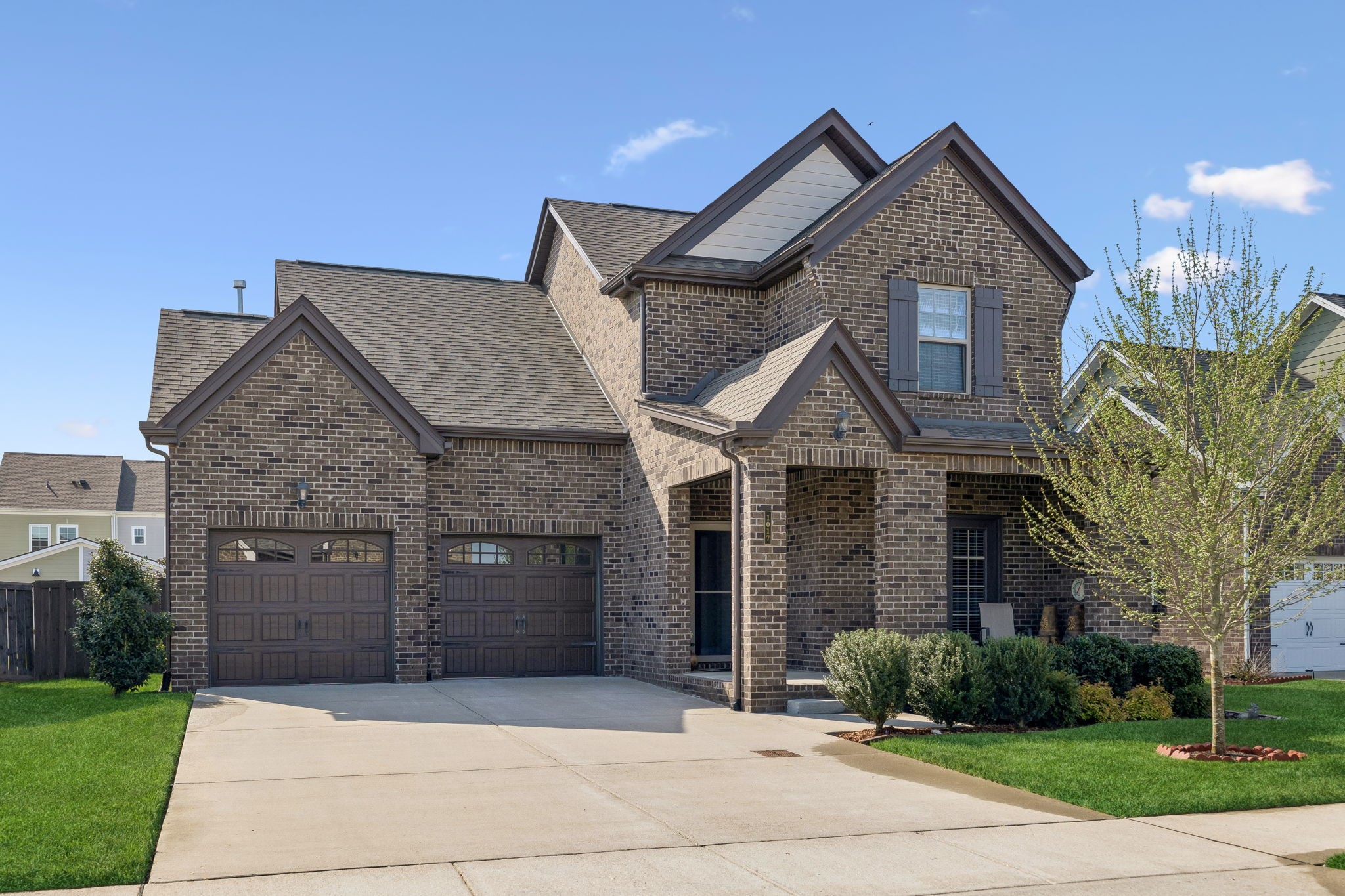 1017 Violet Street Spring Hill, TN 37174 - Photo 2 of 36 a front view of a house with a garden