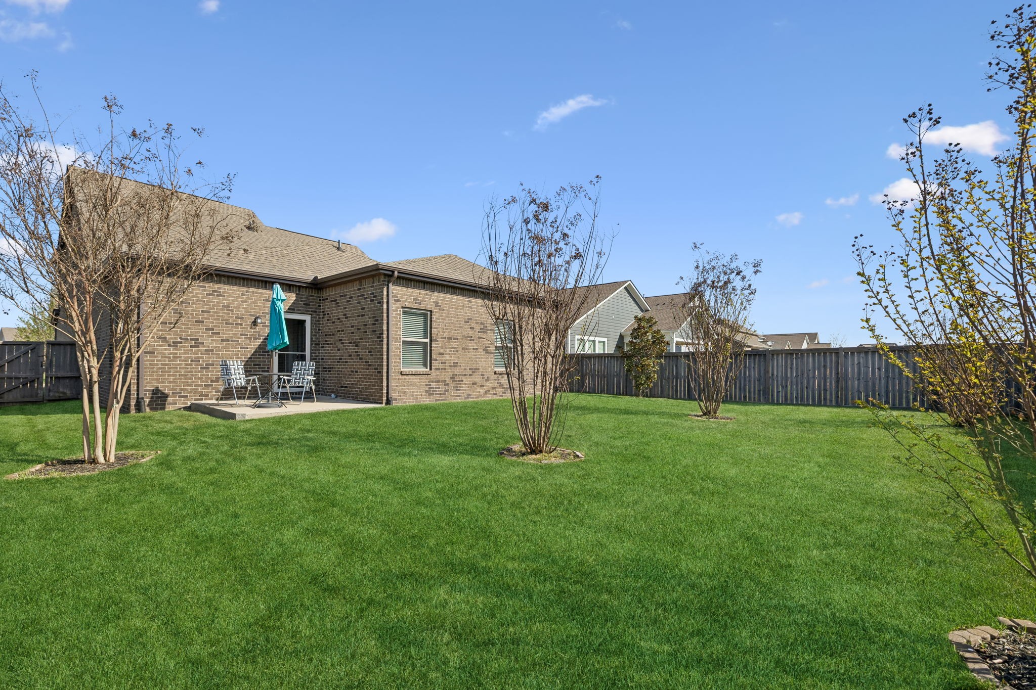 1017 Violet Street Spring Hill, TN 37174 - Photo 29 of 36 a view of a house with a backyard