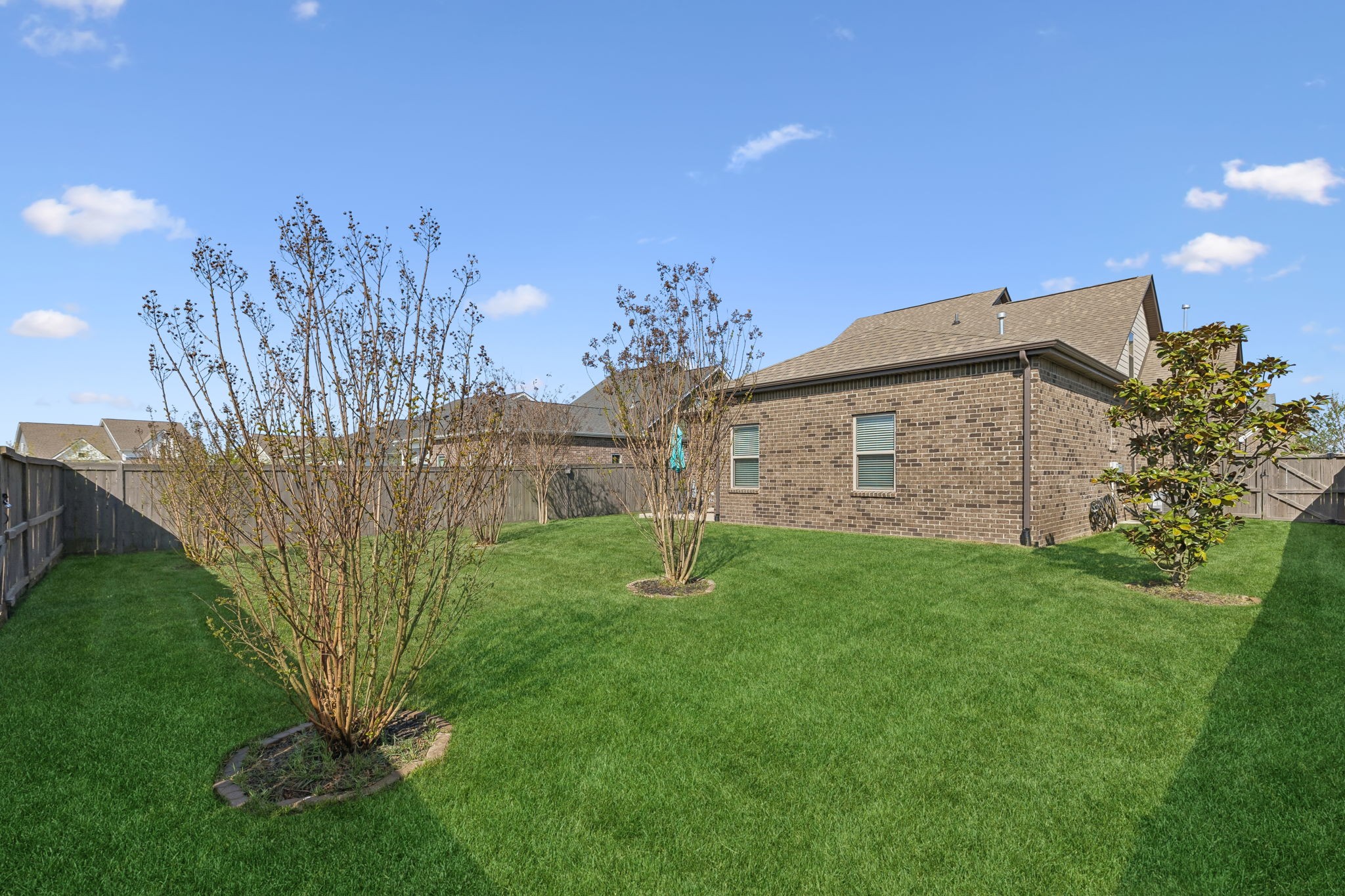 1017 Violet Street Spring Hill, TN 37174 - Photo 31 of 36 a garden with a building in the background