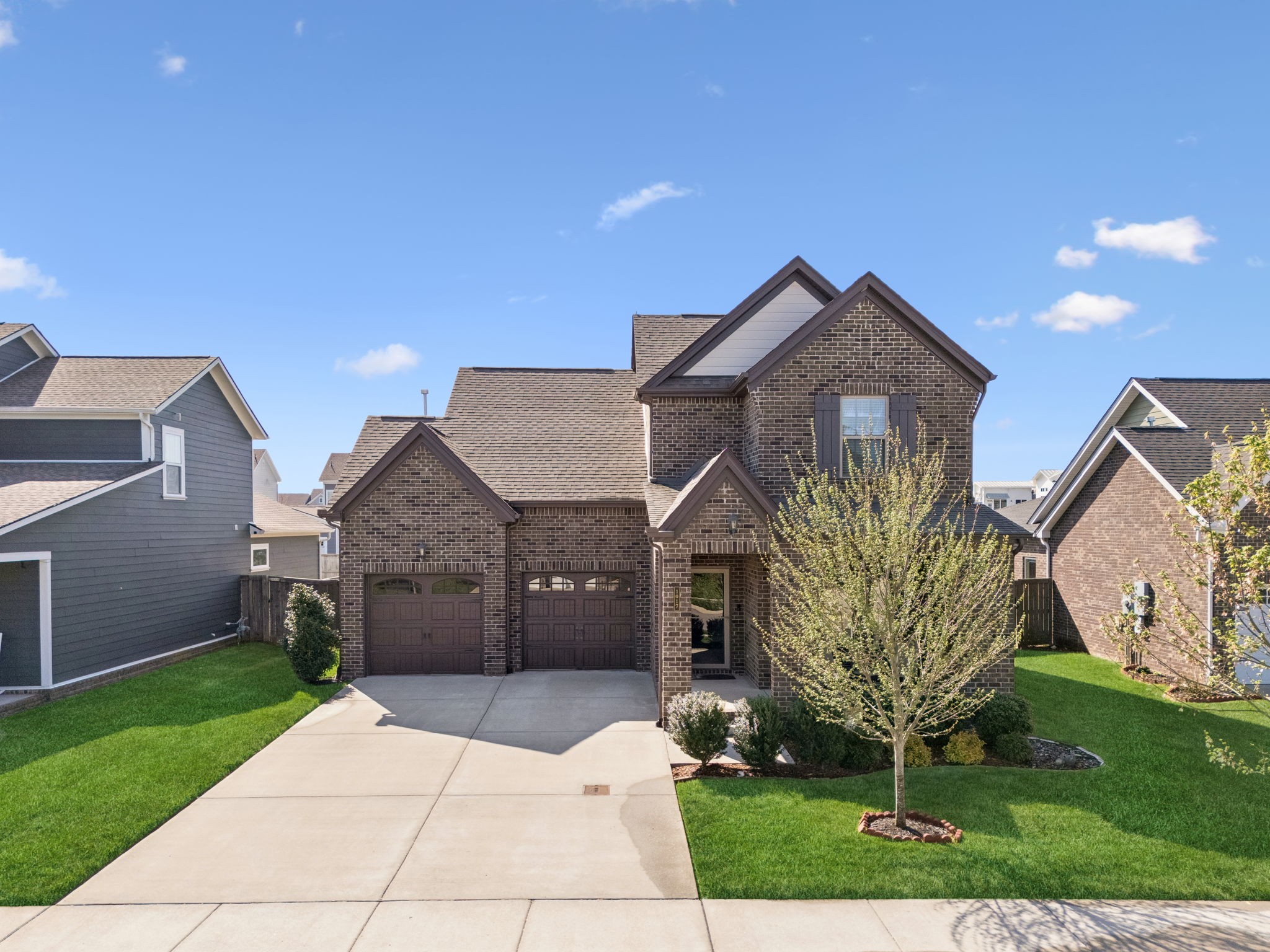 1017 Violet Street Spring Hill, TN 37174 - Photo 32 of 36 a front view of a house with garden