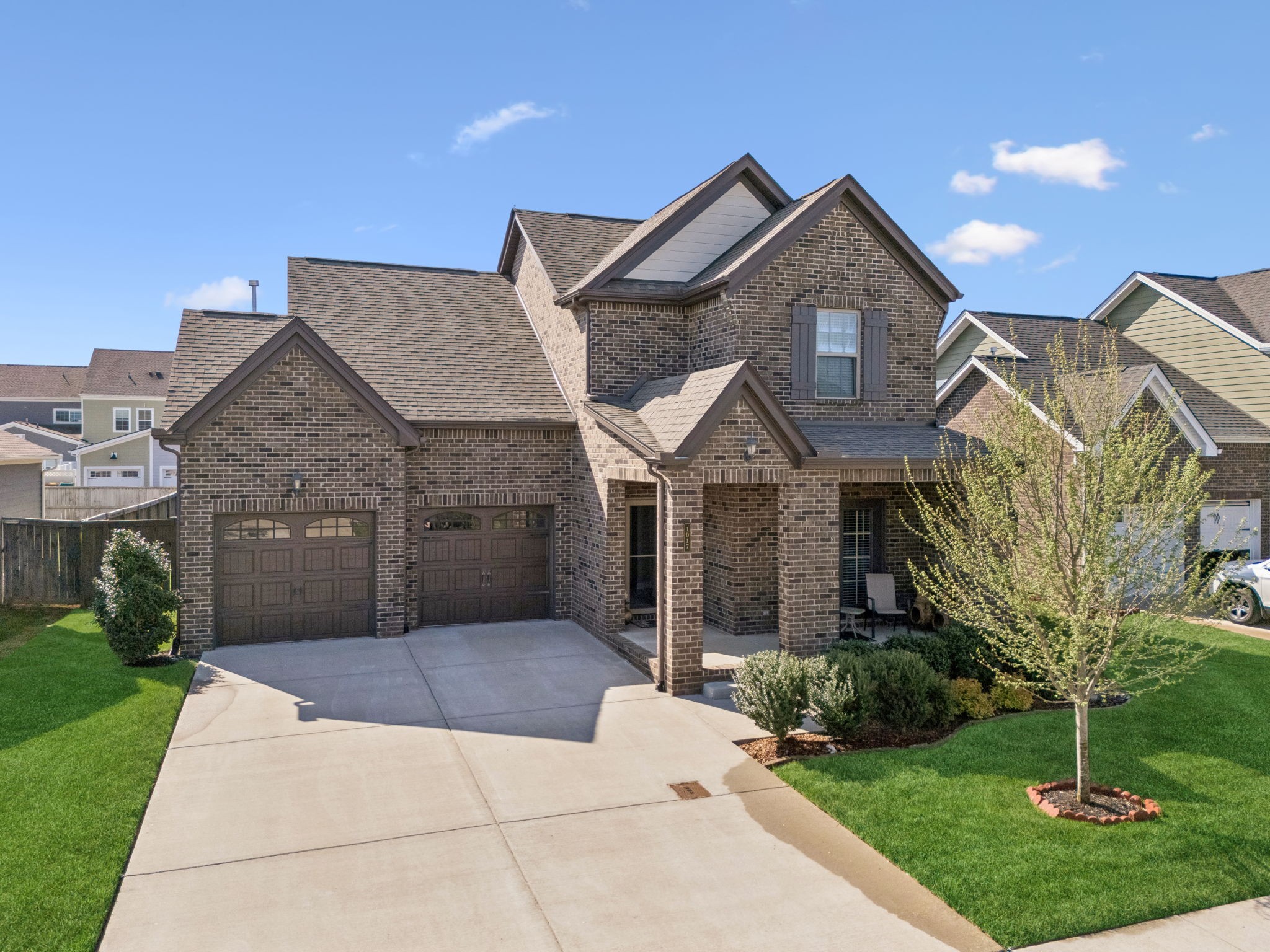 1017 Violet Street Spring Hill, TN 37174 - Photo 33 of 36 a front view of a house with a yard and garage