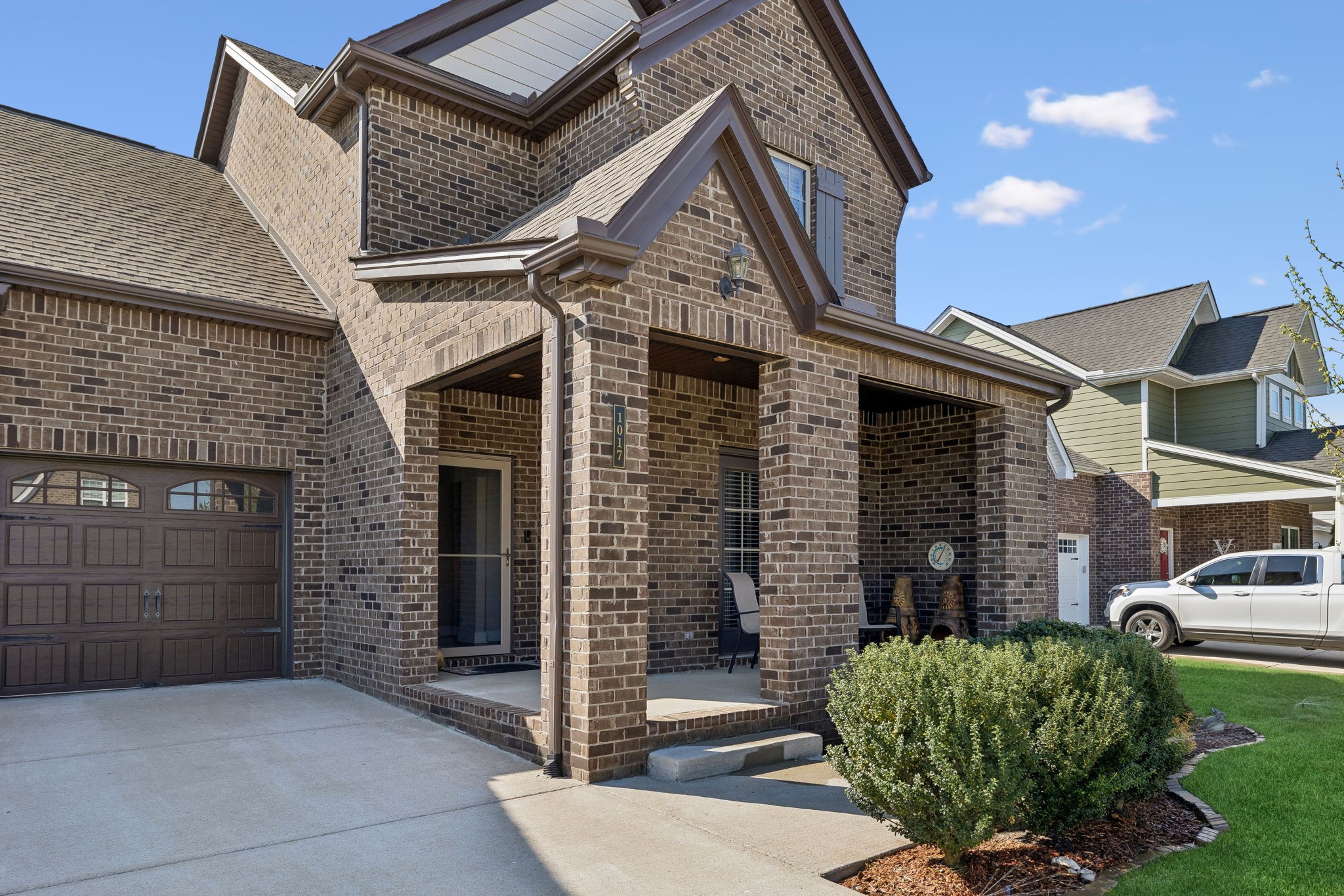 1017 Violet Street Spring Hill, TN 37174 - Photo 4 of 36 a front view of a house with garden