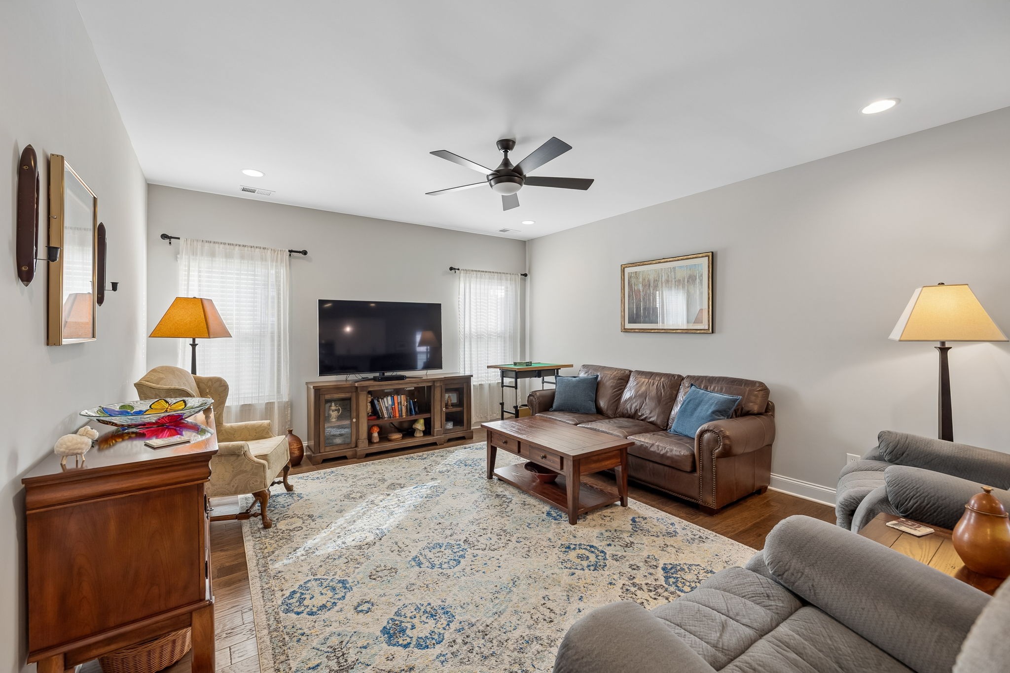1017 Violet Street Spring Hill, TN 37174 - Photo 5 of 36 a living room with furniture and a flat screen tv