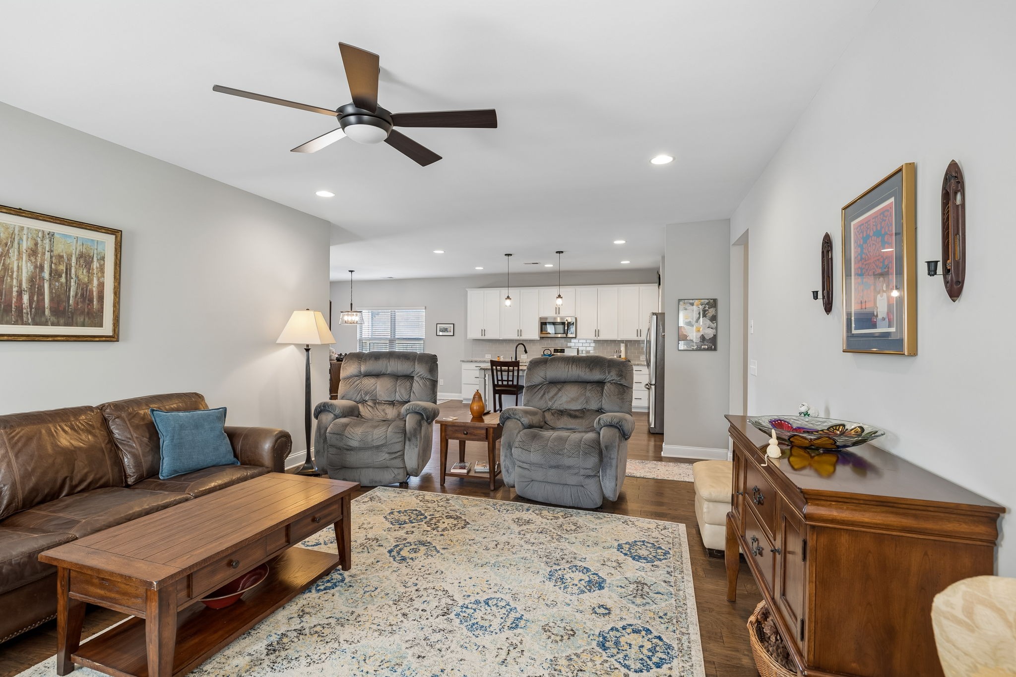 1017 Violet Street Spring Hill, TN 37174 - Photo 6 of 36 a living room with furniture and kitchen view