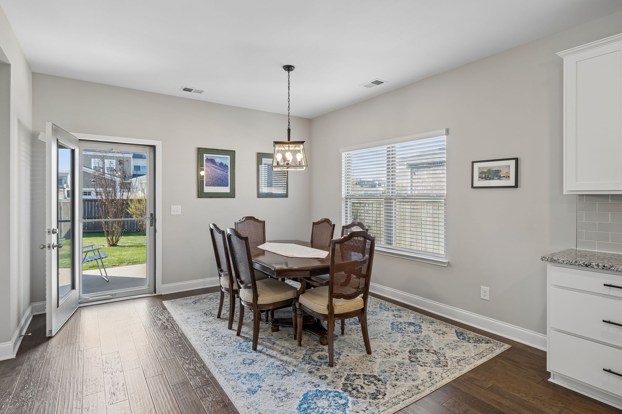 1017 Violet Street Spring Hill, TN 37174 - Photo 8 of 36 a view of a dining room with furniture window and wooden floor