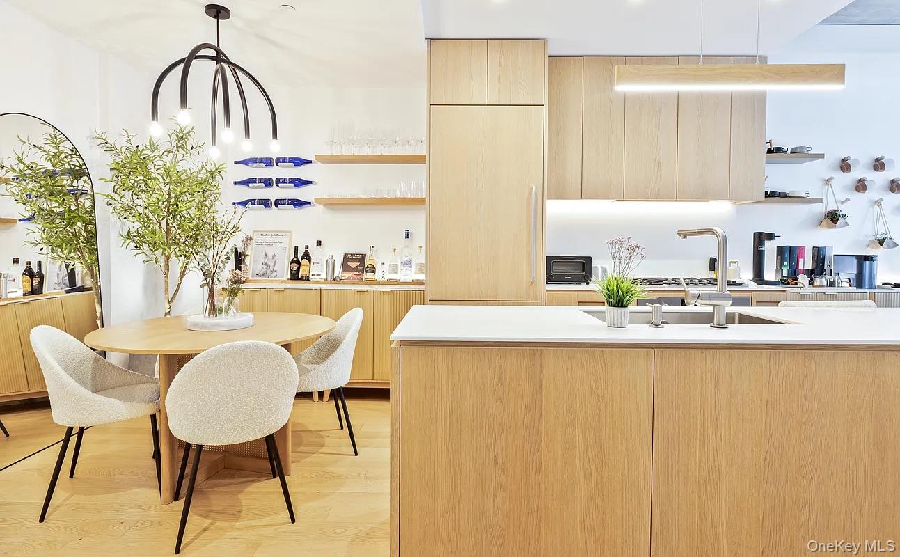 98 Front Street, Unit 9J Brooklyn, NY 11201 - Photo 1 of 10 Kitchen featuring open shelves, light brown cabinetry, modern cabinets, and light wood-style floors