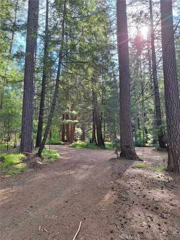 a view of a house with trees in the background