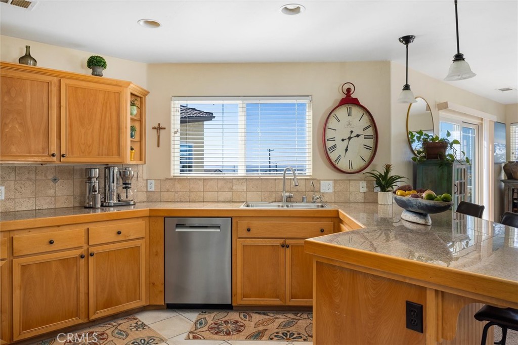 1187 Main Street Morro Bay, CA 93442 - Photo 12 of 33 a kitchen with a sink and cabinets