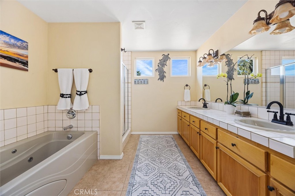 1187 Main Street Morro Bay, CA 93442 - Photo 20 of 33 a bathroom with a tub sink and mirror