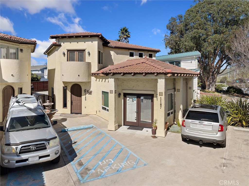 1187 Main Street Morro Bay, CA 93442 - Photo 2 of 33 a car parked in front of a house