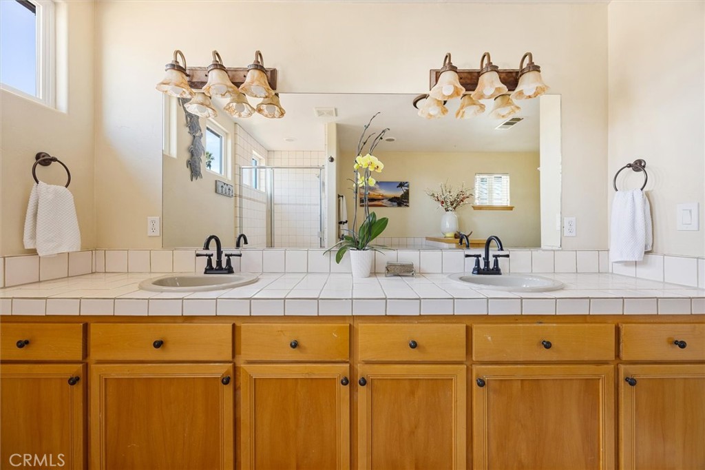 1187 Main Street Morro Bay, CA 93442 - Photo 21 of 33 a bathroom with a sink and a mirror