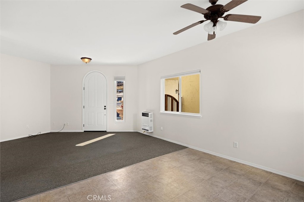 1187 Main Street Morro Bay, CA 93442 - Photo 24 of 33 an empty room with a window and a fan