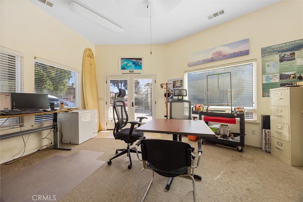1187 Main Street Morro Bay, CA 93442 - Photo 30 of 33 a work room with furniture and a flat screen tv