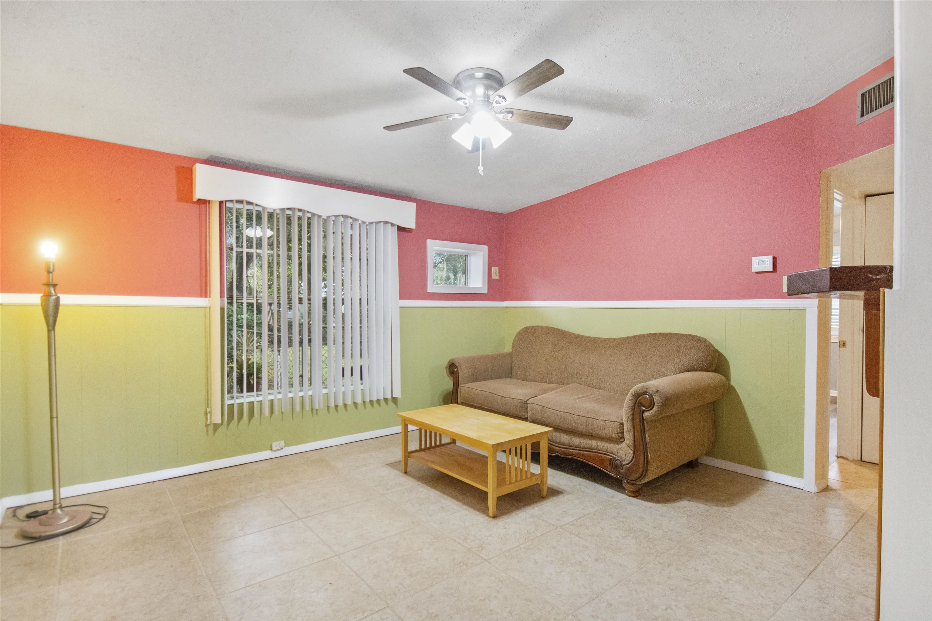 100 Spring Street St. Augustine, FL 32084 - Photo 5 of 21 a living room with furniture and a ceiling fan