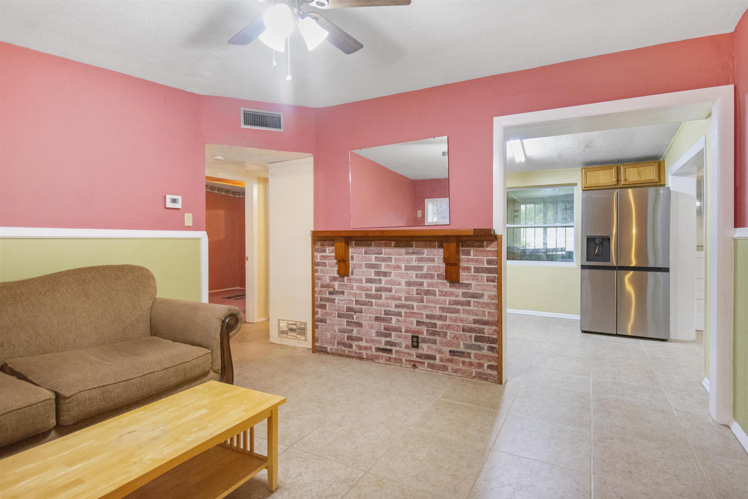 100 Spring Street St. Augustine, FL 32084 - Photo 6 of 21 a living room with furniture and a fireplace