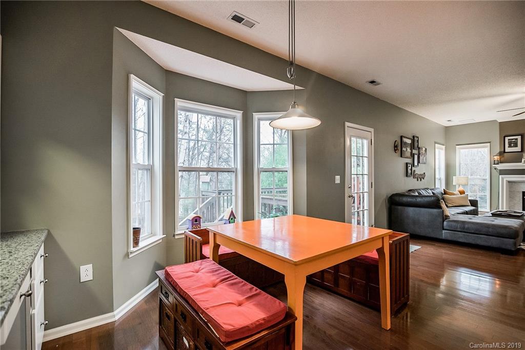 144 Comata Road Mooresville, NC 28117 - Photo 12 of 35 a living room with furniture and a wooden floor