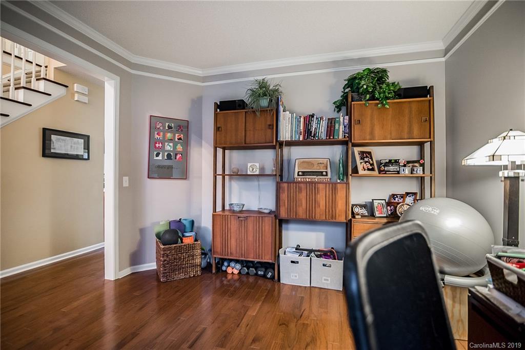 144 Comata Road Mooresville, NC 28117 - Photo 17 of 35 a view of a workspace with furniture and wooden floor