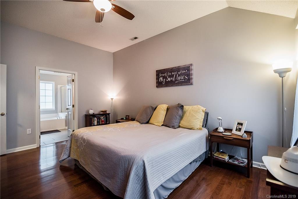 144 Comata Road Mooresville, NC 28117 - Photo 20 of 35 a bedroom with a bed and a chair