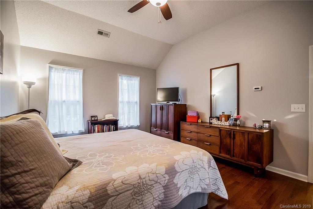 144 Comata Road Mooresville, NC 28117 - Photo 21 of 35 a bed room with a bed and dresser