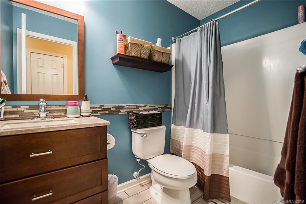 144 Comata Road Mooresville, NC 28117 - Photo 25 of 35 a bathroom with a sink a toilet and shower