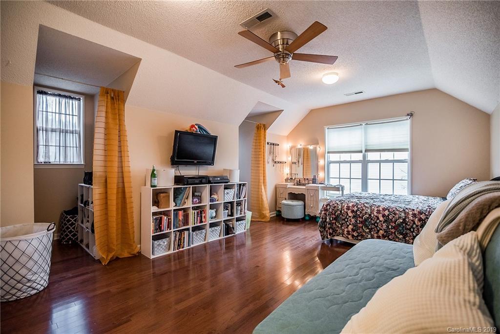144 Comata Road Mooresville, NC 28117 - Photo 26 of 35 a living room with furniture and a flat screen tv