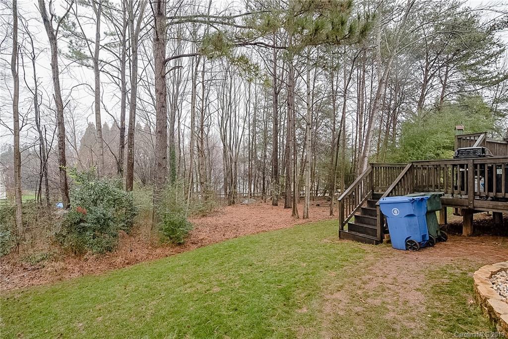 144 Comata Road Mooresville, NC 28117 - Photo 34 of 35 a backyard of a house with table and chairs