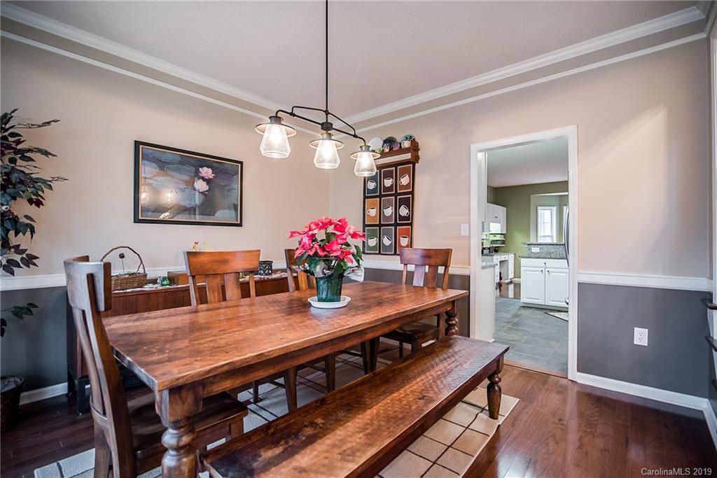 144 Comata Road Mooresville, NC 28117 - Photo 5 of 35 a view of a dining room with furniture and wooden floor