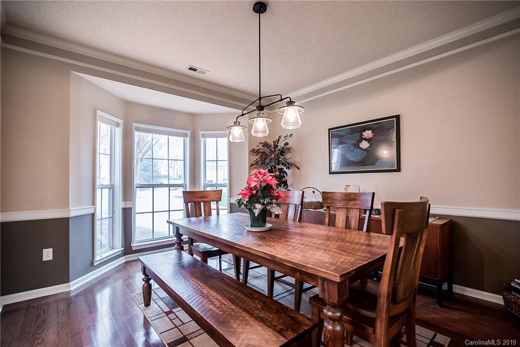 144 Comata Road Mooresville, NC 28117 - Photo 6 of 35 a view of a dining room with furniture window and wooden floor