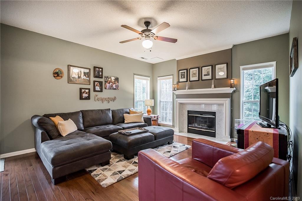 144 Comata Road Mooresville, NC 28117 - Photo 7 of 35 a living room with furniture and a fireplace