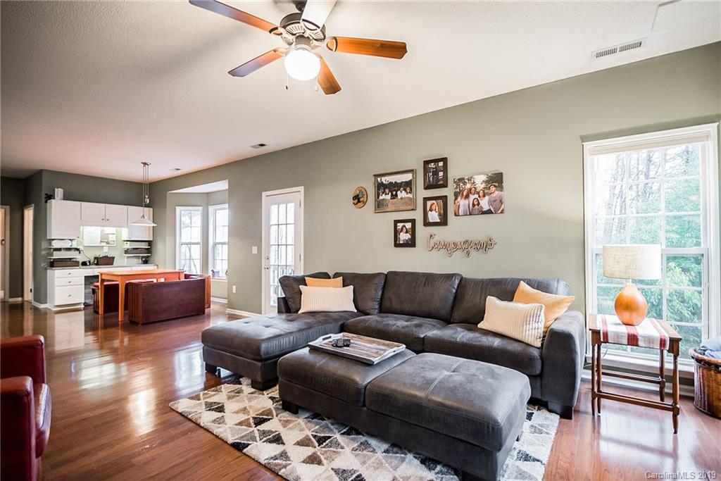 144 Comata Road Mooresville, NC 28117 - Photo 10 of 35 a living room with furniture and wooden floor